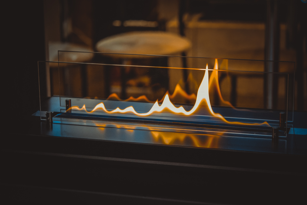 A double-sided glass gas fireplace.