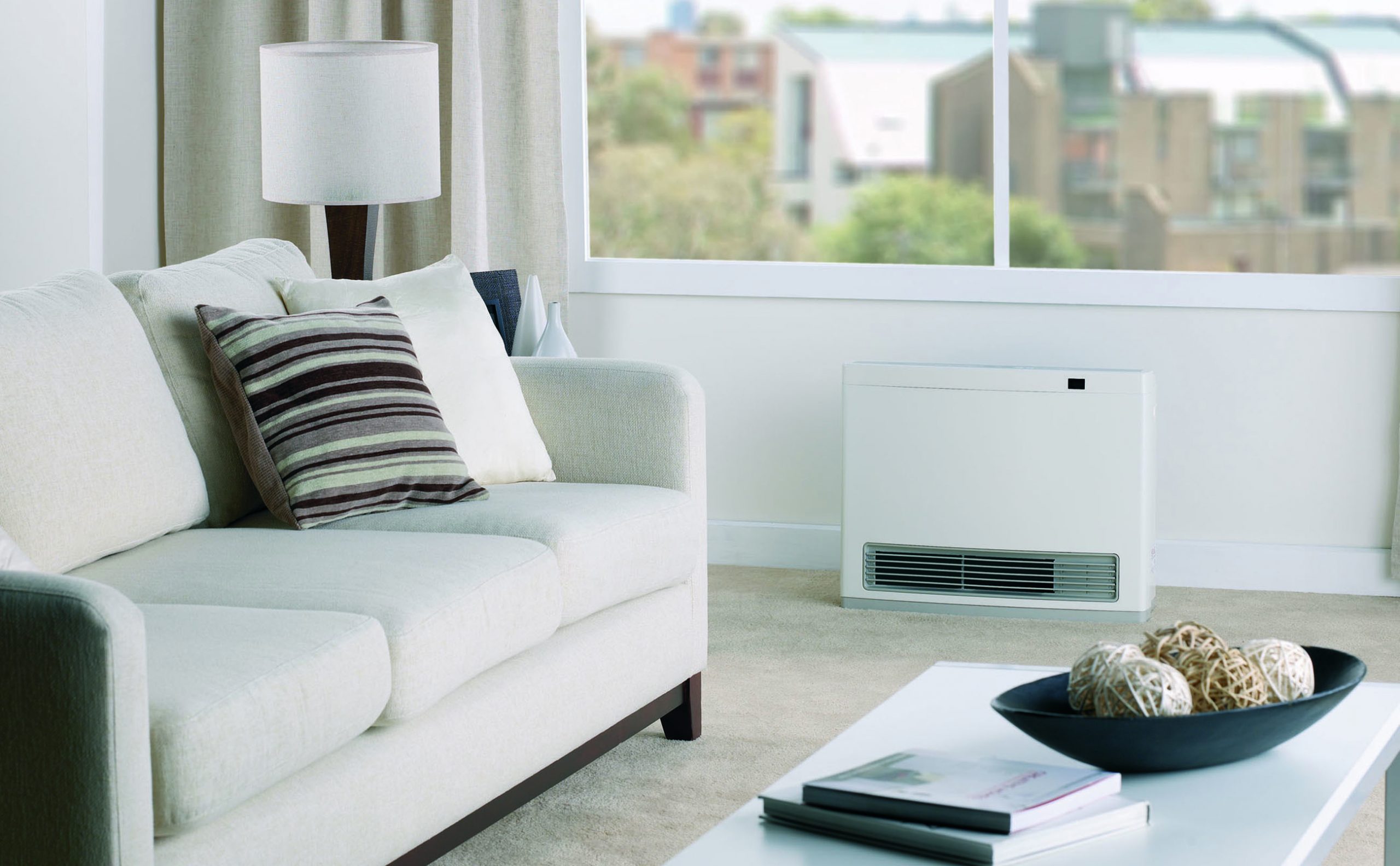 A Rinnai Avenger portable heater in a modern living room.