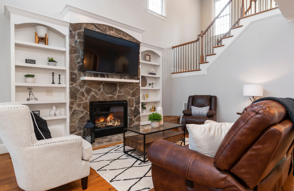 A nook lounge room featuring a stone gas fireplace. 