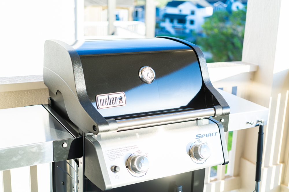A weber Spirit BBQ on a balcony. 