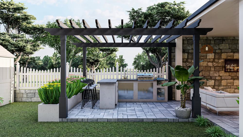 A small outdoor kitchen with a built in BBQ on a patio.