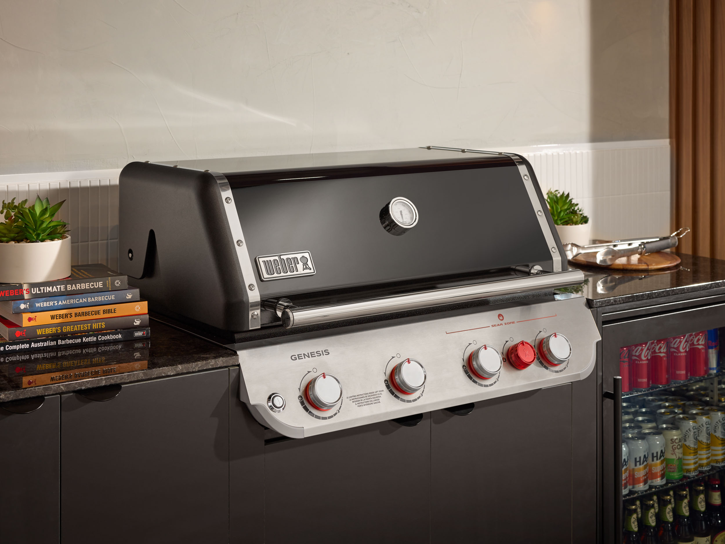 A Home Fires outdoor kitchen set up featuring a Weber BBQ.