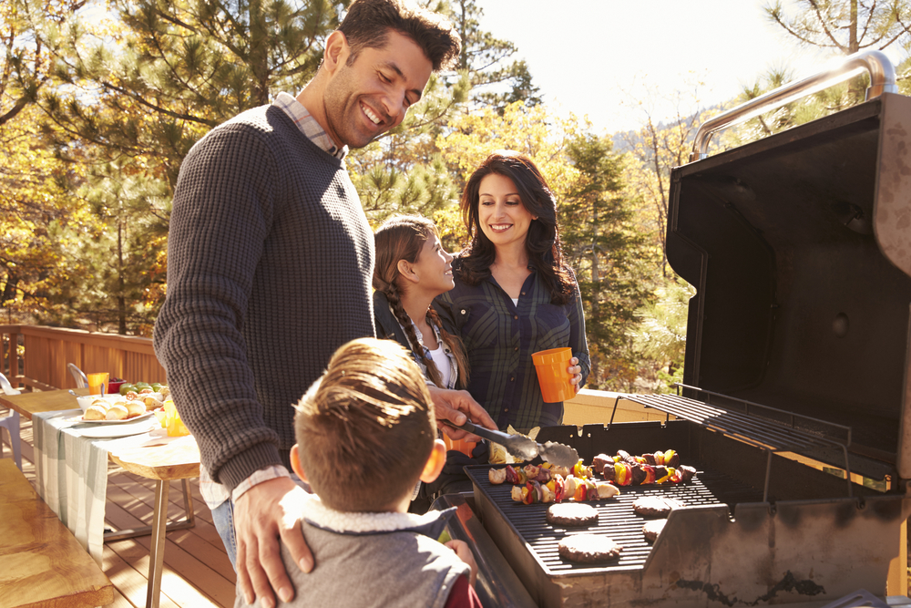 A family enjoying Autumn BBQ recipes in Australia.