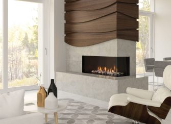 A contemporary multi-sided built in gas fireplace featuring a stone surround and structural timber accents in an open-plan living room.