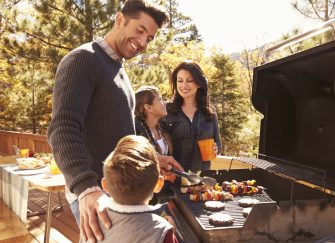 A family enjoying Autumn BBQ recipes in Australia.
