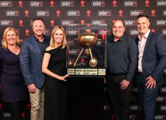 The Home Fires Team pose with their Ross McDonald Award for Most Outstanding Weber Store 2025 for Australia and New Zealand. Everyone is smiling and very proud.